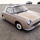 Illustration for article titled A Beige Nissan Figaro is the Opposite of a GT-R